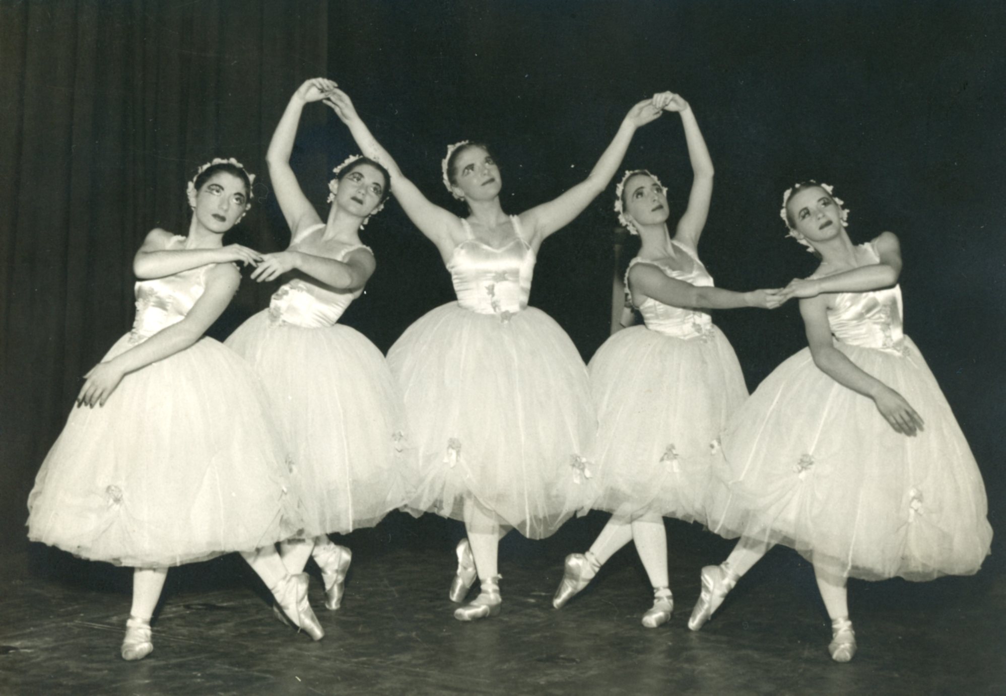 black and white photo of ballet dancers in classical costumes posing in 1945