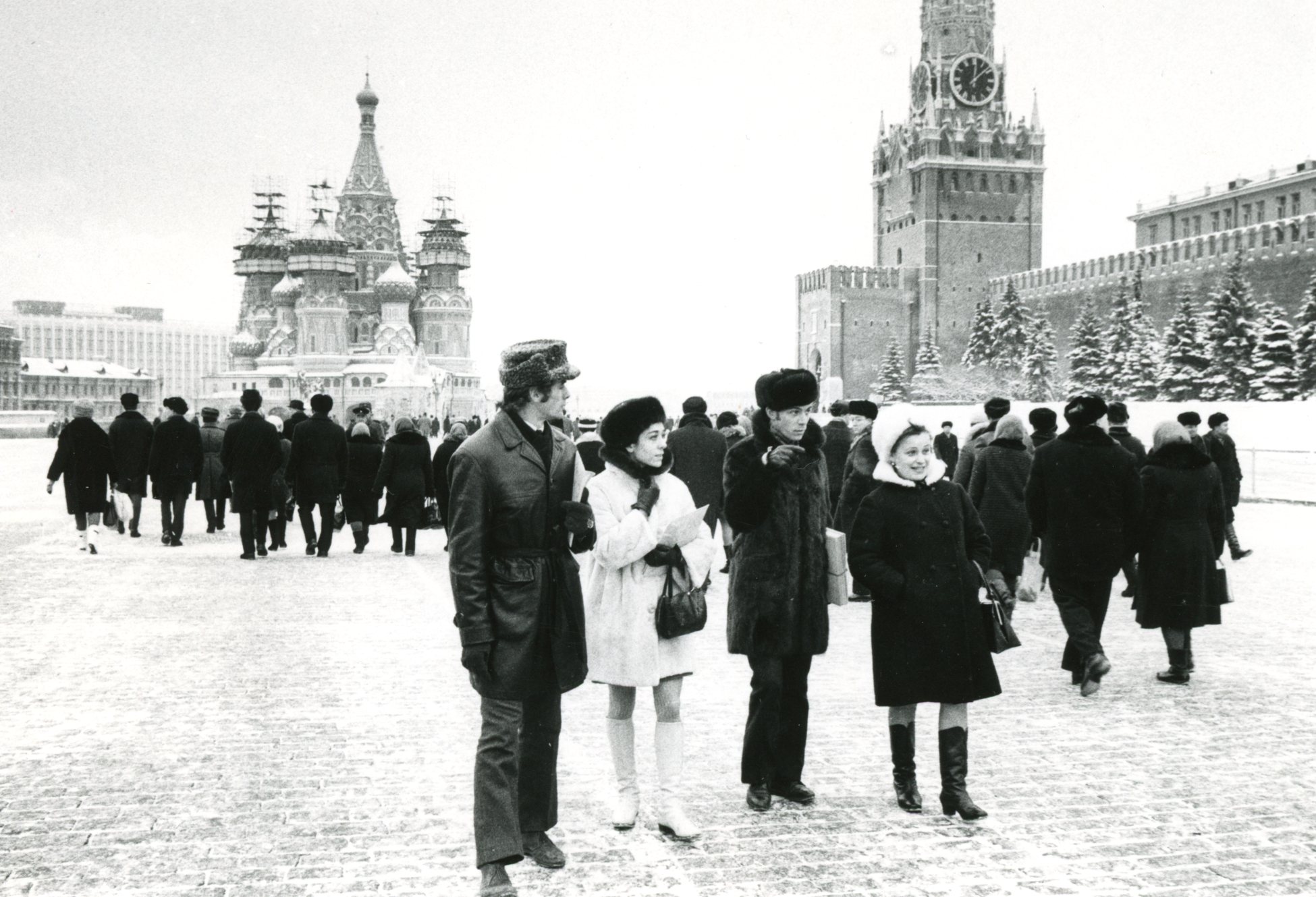 a black and white photo of RWB in Russia wearing winter coats and hats