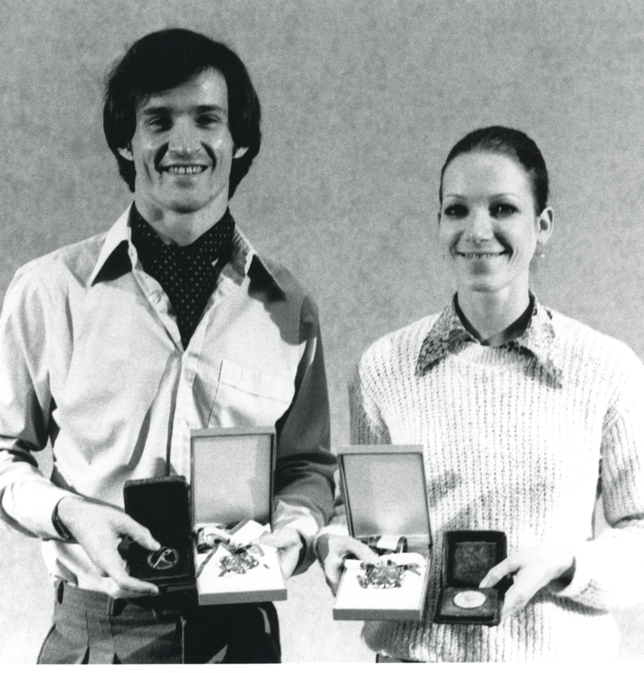a black and white photo of Evelyn Hart and David Peregrine in Varna, Bulgaria holding awards