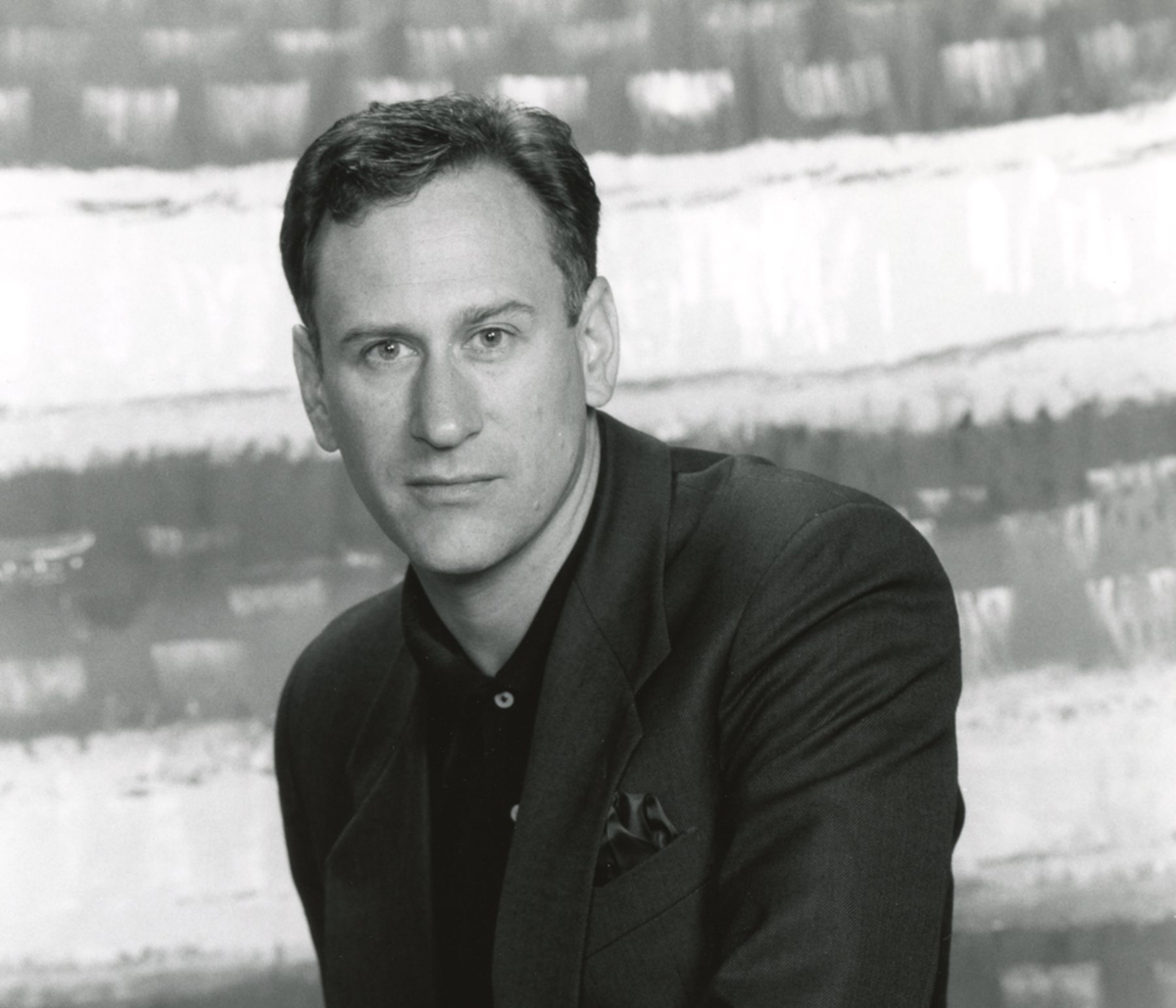 a black and white head shot of William Whitener, a middle age white male with short dark hair