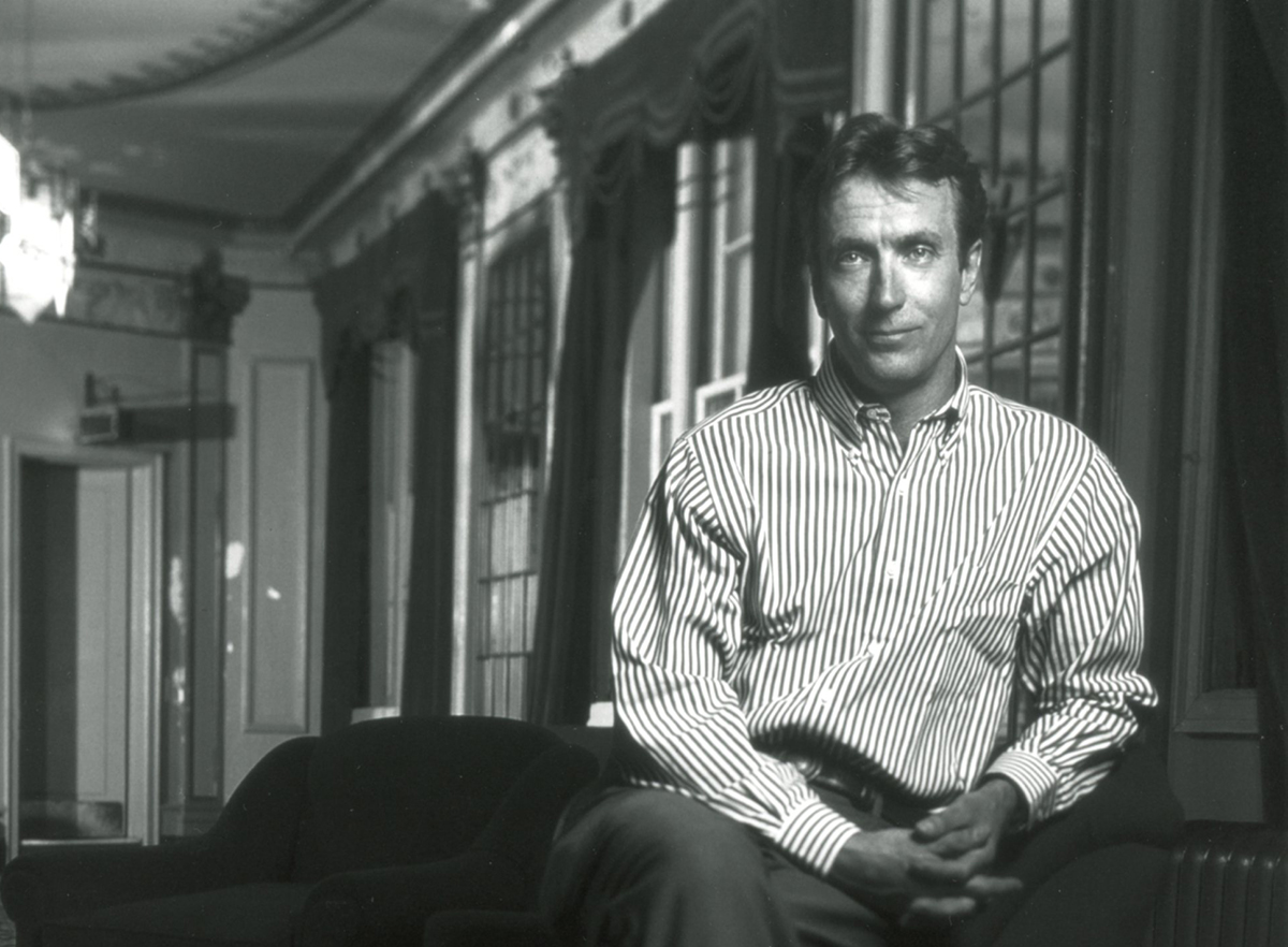 Black and white head shot of André Lewis, a white middle age man with dark short hair